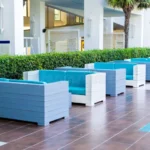 blue-sofas-row-outdoor-lobby-hotel-background-neat-green-spaces-155283513